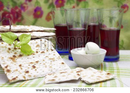 A Photo Of Jewish Matzah Bread, Boiled Eggs, Kosher Red Wine And A Linden Tree Branch. Matzah For Th