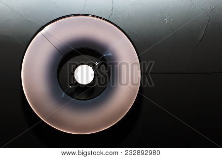 The Round Light Bulb On Black Background