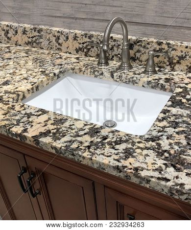bathroom cabinet, bath vanity cabinet, wooden luxury bathroom cabinet. Sink with bathroom granite countertops. Faucet on granite counter top. granite top on bathroom