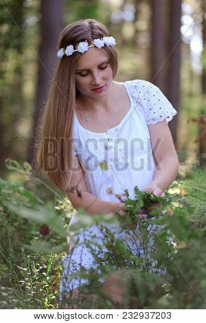 Freckled Woman With Circlet Of Flower On Her Head Portrait In Autumn Forest In A Day Light.