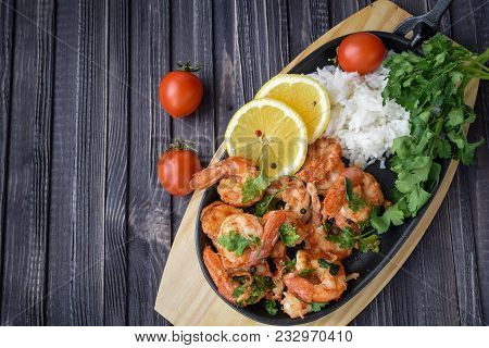 Roasted Shrimps With Lemon, Garlic,herbs And White Rise, Seafood Shelfish Shrimps Prawns Grilled Wit