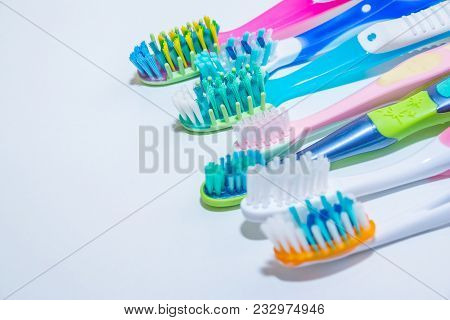 Whitening. Tooth Care. Teeth Healthy Concept. New Ultra Soft Toothbrushes In A Row, Dental Industry.