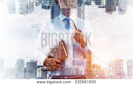 Confident And Young Businessman In Smart-casual Wear Smoking Pipe And Modern Cityscape With Business