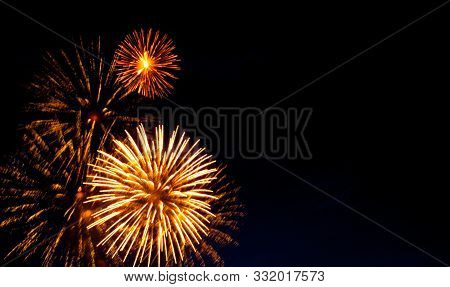 Beautiful Firework Display With The Space For Your Text. Brightly Colorful Fireworks And Salute Of V