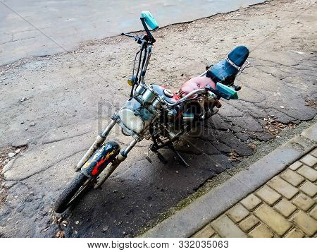 A Motorcycle Assembled With Your Own Hands Is Standing Near A Supermarket A Motorcycle Assembled Fro