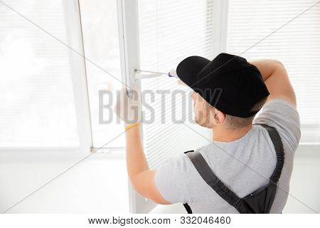 Construction Worker Man Install Plastic White Upvc Windows In House