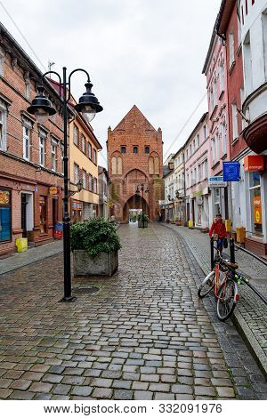Swidwin, Zachodniopomorskie / Poland - November, 6, 2019: Old Gate Of The City Walls. Red Brick Buil