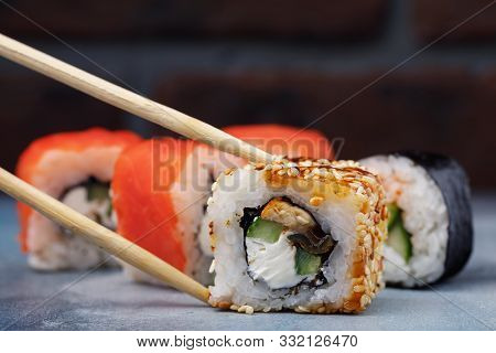 Rolls Unagi Maki With Cucumber, Eel And Sesame. Japanese Restaurant Menu With Space For Text