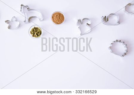 Animal Cookie Cutters On White Table, Top View. Cinammon And Cardamom Spice. Space For Text, Copy-sp