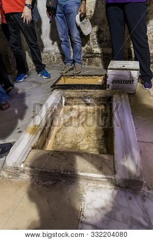 Jerusalem, Israel, November 02, 2019 : Stone With The Footprint Of The Foot Of Christ Surrounded By 