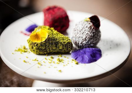 Vegan Truffles Dessert Served On A Plate In Restaurant