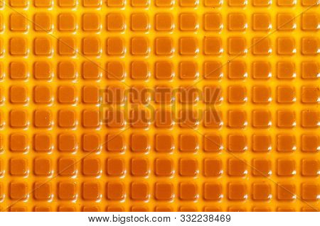 Texture With Square Yellow Elements. Plastic Candy Lining.