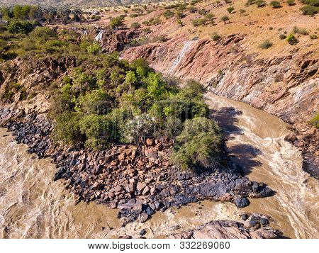 Aerial Landscape Epupa Falls, Kunene River In Northern Namibia And Southern Angola Border. Beautiful