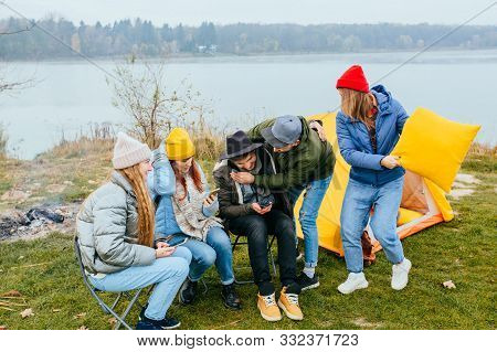 Group Of Best Friends Millennial Or Generation Z Chatting With Smartphones Realxing Enjoying Holiday