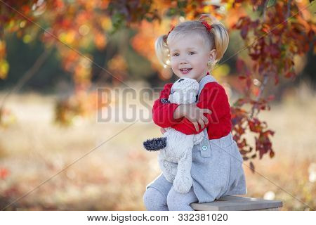 Little Fashionista. Happy Girl On Autumn Day. Little Girl Happy Smiling With Autumn Leaves. Girls Au