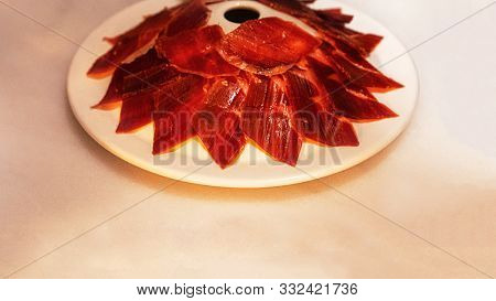 Slices Of Traditionally Spanish Jamon De Bellota In The Restaurant Or Market Or Store.