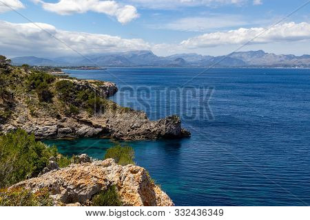 Bay Ses Caletes On The Peninsula La Victoria, Mallorca With Rocky Coastline And Turquoise Clear Wate