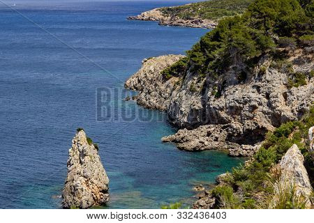Bay Ses Caletes On The Peninsula La Victoria, Mallorca With Rocky Coastline And Turquoise Clear Wate