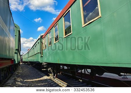 Between Cars Of Vintage Trains, Between Two Old Trains, Old Green Wagons, Railway