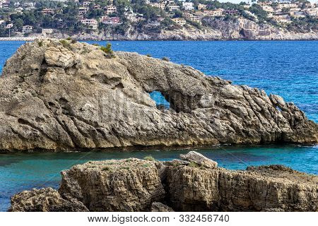 Rocky Coast At Peguera In The West Of Mallorca On A Sunny Day In Spring