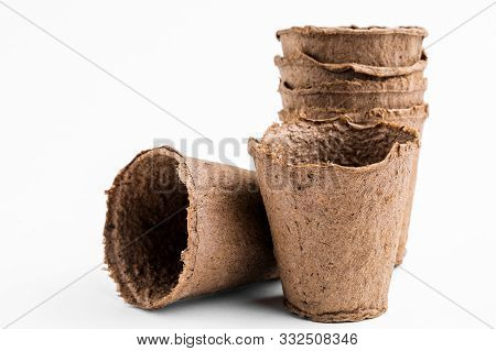 Pots For Seedlings Of Ecological Cardboard. Peat Seed Pots. Pots On Isolated White Background