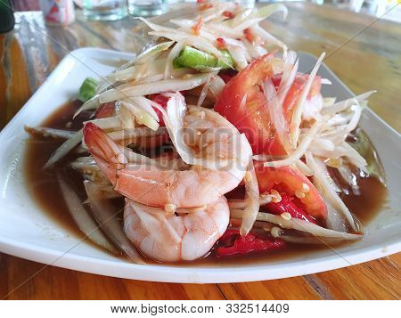 Thai Food Style, Selective Focus Of Papaya Salad With Tomato, Shrimp, Chili And Bean Isolated On Woo