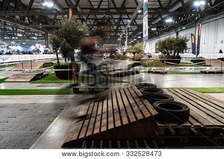 Rho Fieramilano, Milan Italy - November 07, 2019 Eicma Expo. Biker In Movement Jump A Ramp In The Te