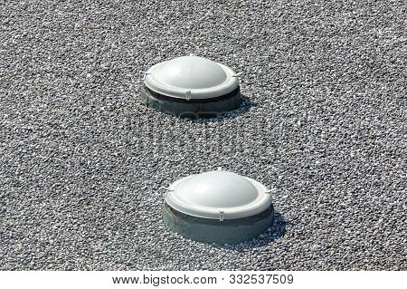 Skylight Windows At Gravel Flat Roof Building