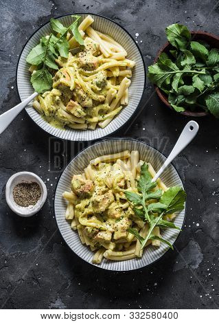 Curried Creamy Salmon With Pasta On A Dark Background, Top View