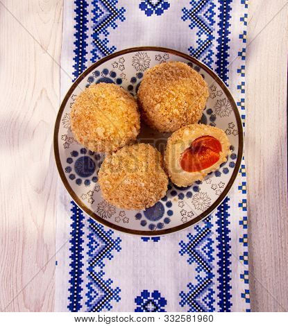 Austrian And Czech Sweet Dessert Knedle Apricot Dumplings On Fabric With Ornament Background. Filled