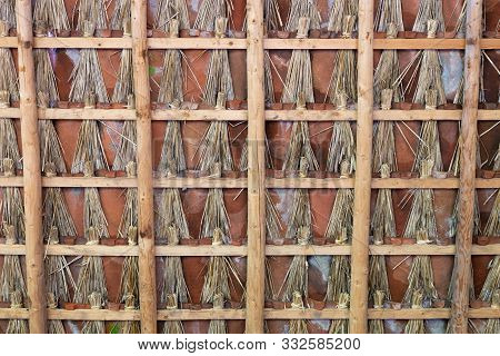 Roof Of Farm Shed With Tiles, The Gates Are Filled With Bunches Of Reed To Make The Roof Draught-fre