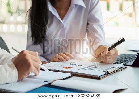 A Male Business Consultant Describes A Marketing Plan To Set Business Strategies For Women Business 