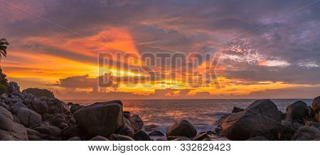 Panorama Sunset At Laem Sai Cape. Many Small And Large Stones Surround Laem Sai Cape From Karon Beac