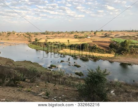 Landscape Of River In Cloudy Days - A View Of Narmada River Taken From Train Window