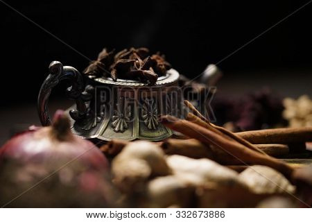 Spices And Herbs On Old Kitchen Table.
