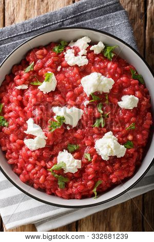Orzotto With Beets, Parmesan, Goat Cheese And Herbs Close-up On A Plate. Vertical Top View