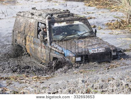 Almaty, Kazakhstan - September 29, 2019: Off-road Jeep Competition. Dirt And Splash Of Water In Off-