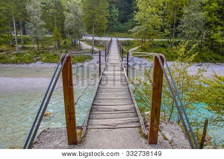 Swingbridge Over Soca River Near Bovec In Triglav National Park, Slovenia, Europe.