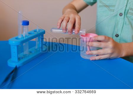 Chemistry. Science. Experiment. Education. Study. Boy Working With Test Tubes. Little Kid With Test 