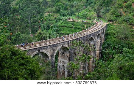 Ella/ Demodara, Sri-lanka: August 08/ 2019: The Local Train Acrossing The Nine Arches Demodara Bridg