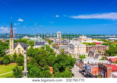 Charleston, South Carolina, USA skyline over Marion Square at dusk.