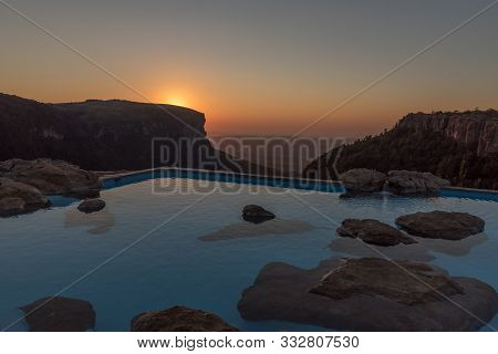 Graskop, South Africa - May 21, 2019: Sunrise At The Swimming Pool On The Edge Of A Cliff At The Pan
