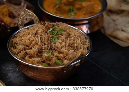 Indian Tamarind Rice Served In Copper Bowl
