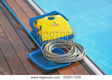 Pool Cleaner During His Work. Cleaning Robot For Cleaning The Botton Of Swimming Pools. Automatic Po