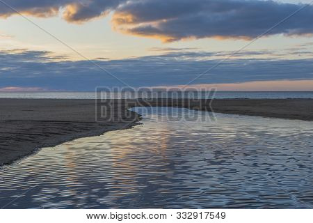 Evening Sky Over The Beach, The River Anapka Flowing Into The Black Sea. Anapa, Krasnodar Krai, Russ