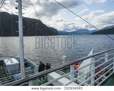 Valldal, Norway, September 7, 2019: Young People Couple On Board Of Ferry Boat To Geiranger. Woman T