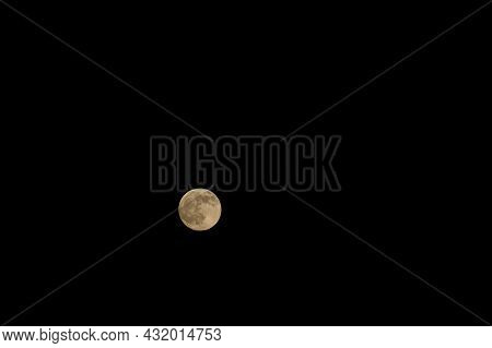 Dark And Almost Black Sky With A Bright Moon.