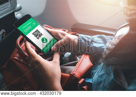 Woman Hand Using Digital Health Passport App In Mobile Phone For Travel During Covid-19 Pandemic, Va