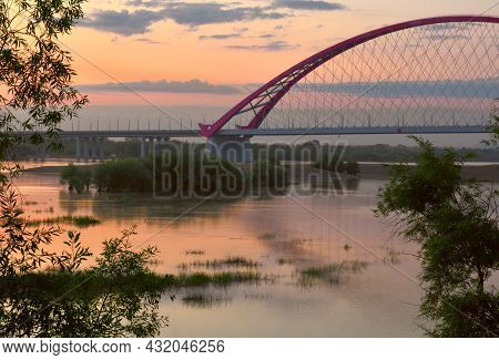 Bugrinskij Bridge Across The Ob River At Dawn. High Arched Cable-stayed Road Bridge Across The Wide 