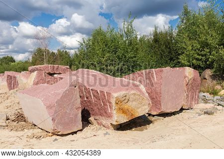 Large Blocks Of Red Granite With Flat After Stone Cutting Tool And Torn Edges, With Marks Of Implodi